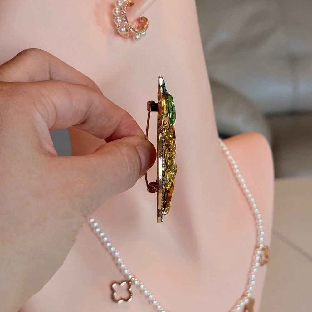 Elegant Gold and Green Crystal Brooch